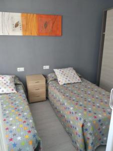 Posteľ alebo postele v izbe v ubytovaní Santa Pola, calle Gabriel Miro, 27 Апартаменты