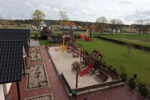 an aerial view of a park with a playground at Domki DRAGON Łeba in Łeba