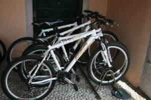 two bikes are parked in front of a door at Agriturismo La Filanda in Manerba del Garda