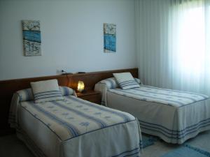 Ένα ή περισσότερα κρεβάτια σε δωμάτιο στο Pensión Bella Vista