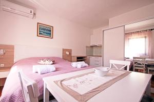 Voodi või voodid majutusasutuse Apartments Kondrić toas