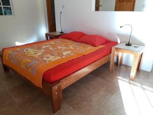 Letto o letti in una camera di Mango Garden Cottages