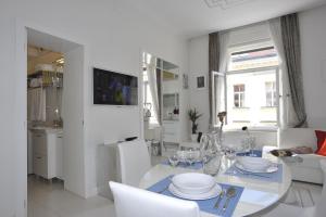 Televízia a/alebo spoločenská miestnosť v ubytovaní Apartment Arum-Lily