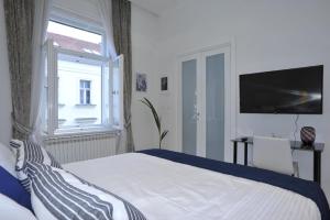 Posteľ alebo postele v izbe v ubytovaní Apartment Arum-Lily
