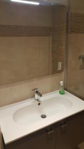 a bathroom sink with a large mirror above it at Très bel appartement centre ville 2 mn plages et marché in Dinard +22 photos