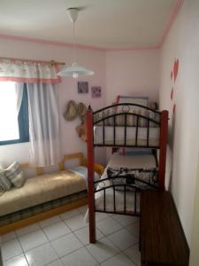 Postel nebo postele na pokoji v ubytování Prédio Frente a Praia