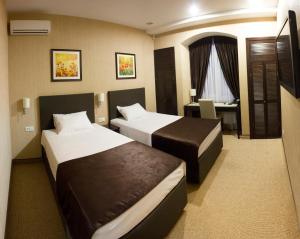 Tempat tidur dalam kamar di Al Mar Hotel