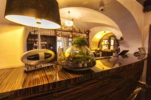 a bar with a fish bowl on top of a counter at Riverside Hotel in Włocławek