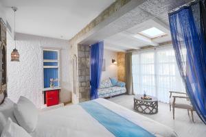 Postel nebo postele na pokoji v ubytování Alakapi Hotel & Villas