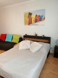 Cama ou camas em um quarto em Apartamenty nad Morzem