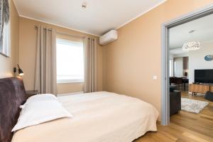 Postel nebo postele na pokoji v ubytování Viru Väljak Lux Apartment