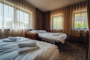 Postel nebo postele na pokoji v ubytování Guest House EJGA