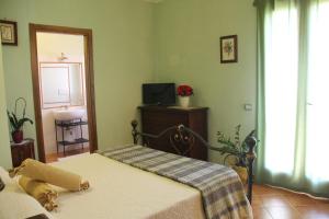 Postel nebo postele na pokoji v ubytování B&B Il Giardino