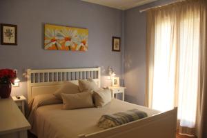 Postel nebo postele na pokoji v ubytování B&B Il Giardino