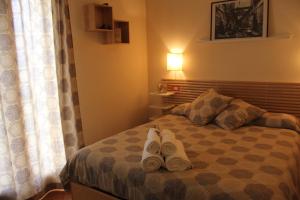 Postel nebo postele na pokoji v ubytování B&B Il Giardino