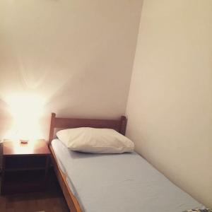 Postel nebo postele na pokoji v ubytování Buffet M Apartments and Rooms Obrovac