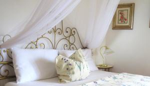 A bed or beds in a room at Casa San Tomè