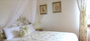 A bed or beds in a room at Casa San Tomè