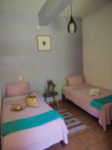Postel nebo postele na pokoji v ubytování Azul Cielo Hostel