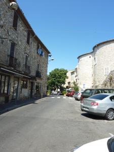 a street with cars parked on the side of a building at 6 rue de la tourraque in Antibes