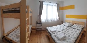 Postel nebo postele na pokoji v ubytování Ubytování pod rozhlednou