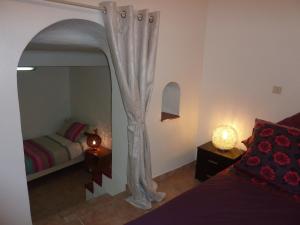a bedroom with a bed and a large mirror at 6 rue de la tourraque in Antibes