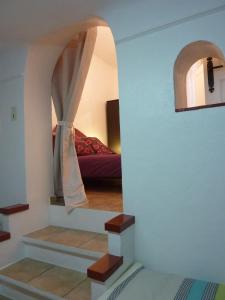 a stairway leading to a bedroom with a bed at 6 rue de la tourraque in Antibes