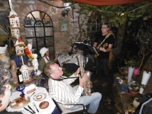 a man playing a saxophone at a party at Gästehaus Chateau d‘Orsay in Rheinberg