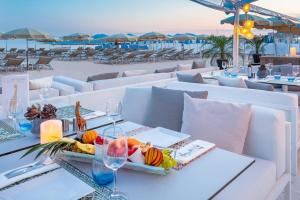 a table with a tray of food on a beach at Croisette View Lux Flat Cannes in Cannes