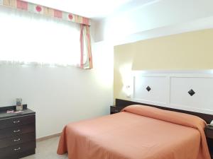 Postel nebo postele na pokoji v ubytování Hotel Orizzonte