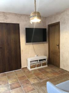 Telewizja i/lub zestaw kina domowego w obiekcie El Cortijillo