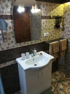 a bathroom with a sink and a mirror at Isabellental - Blacksmithing in Stříbro