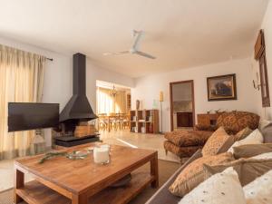 a living room with a couch and a tv at Ses Vistes in Nuestra Señora de Jesus