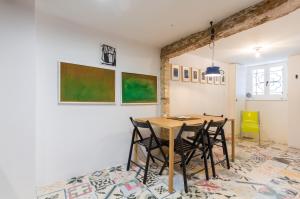 a dining room with a table and chairs at Little Tower With Terrace by Locap Group in Piran