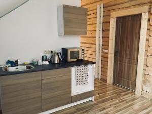 Kuchyň nebo kuchyňský kout v ubytování Room in a Scandinavian Style House
