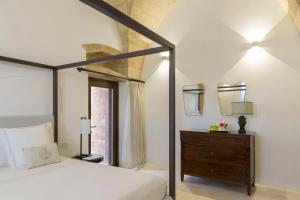 Postel nebo postele na pokoji v ubytování Castello di Ugento