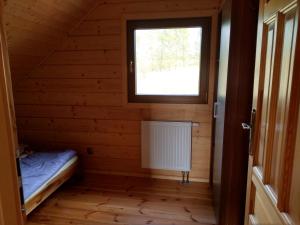 Posteľ alebo postele v izbe v ubytovaní Domek u Charnasia