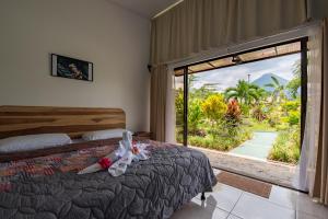 Rúm í herbergi á Hotel Secreto La Fortuna
