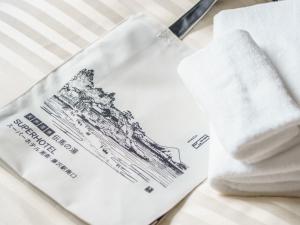 Postel nebo postele na pokoji v ubytování Super Hotel Shonan Fujisawaeki Minamiguchi