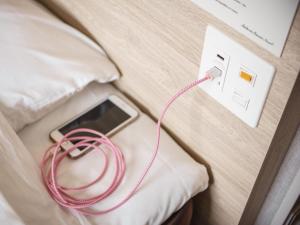 Postel nebo postele na pokoji v ubytování Super Hotel Shonan Fujisawaeki Minamiguchi