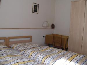 Cama o camas de una habitación en Appartamenti Suttru