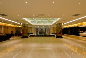 a dance floor with two columns in a building at Merlinhod Hotel Xi'an (Bell & Drum Tower Branch) in Xi'an