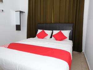 Ένα ή περισσότερα κρεβάτια σε δωμάτιο στο OYO 905 Hotel De'light Villa