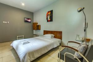 Ένα ή περισσότερα κρεβάτια σε δωμάτιο στο Jeng Tini Guest House