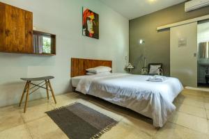 Ένα ή περισσότερα κρεβάτια σε δωμάτιο στο Jeng Tini Guest House