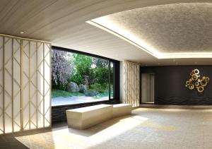 a living room with a large window and a couch at Shizutetsu Hotel Prezio Kyoto Shijo in Kyoto