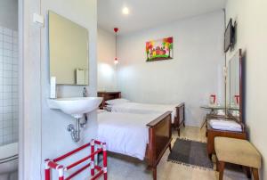 Ένα ή περισσότερα κρεβάτια σε δωμάτιο στο Jeng Tini Guest House