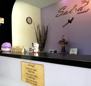 a counter of a salon with a sign on it at Salsa Resort Langkawi By Casa Loma in Pantai Cenang