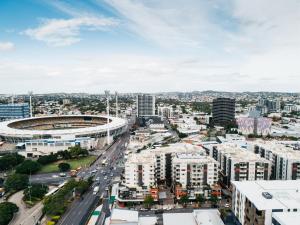 an aerial view of a city with buildings at Gabba Central Apartments in Brisbane