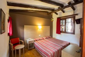 Postel nebo postele na pokoji v ubytování Hotel - Bungalows Don Juan Tossa